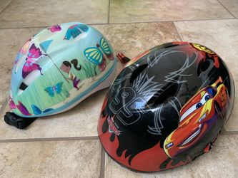 Boy and girl ridding helmets