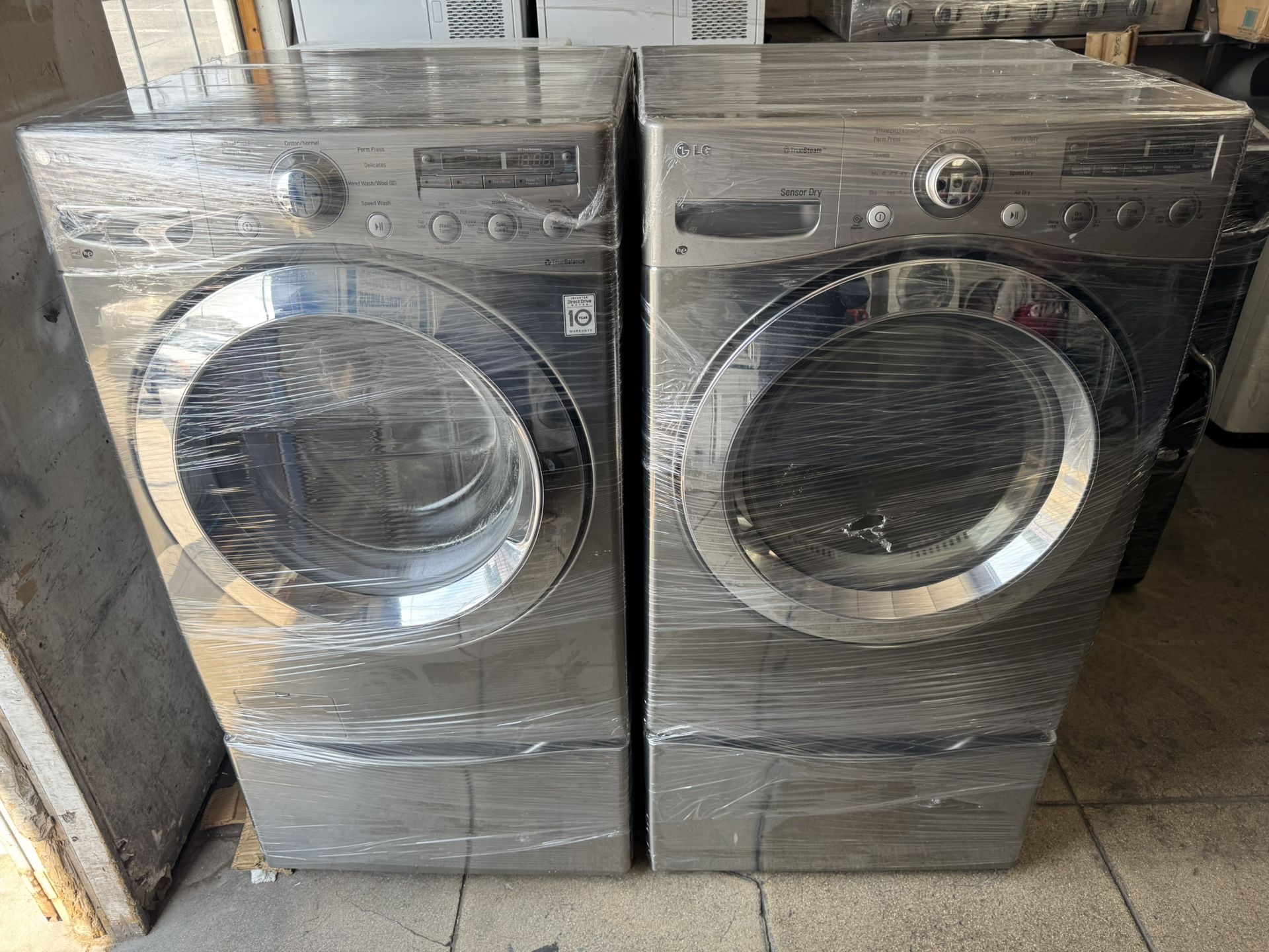 Lg Stainless Steel Washer And Dryer Set With Pedestal