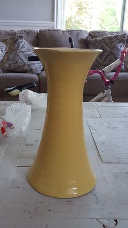 Chipped yellow vase