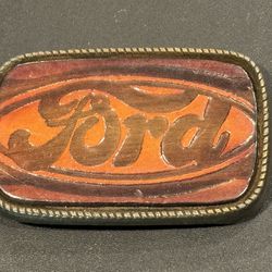 Vintage Ford Leather Belt Buckle No. 101. Approximately 3.25” x 2” USA