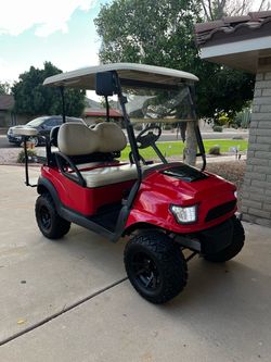 Red Lifted club car Golf Cart with LED Headlights