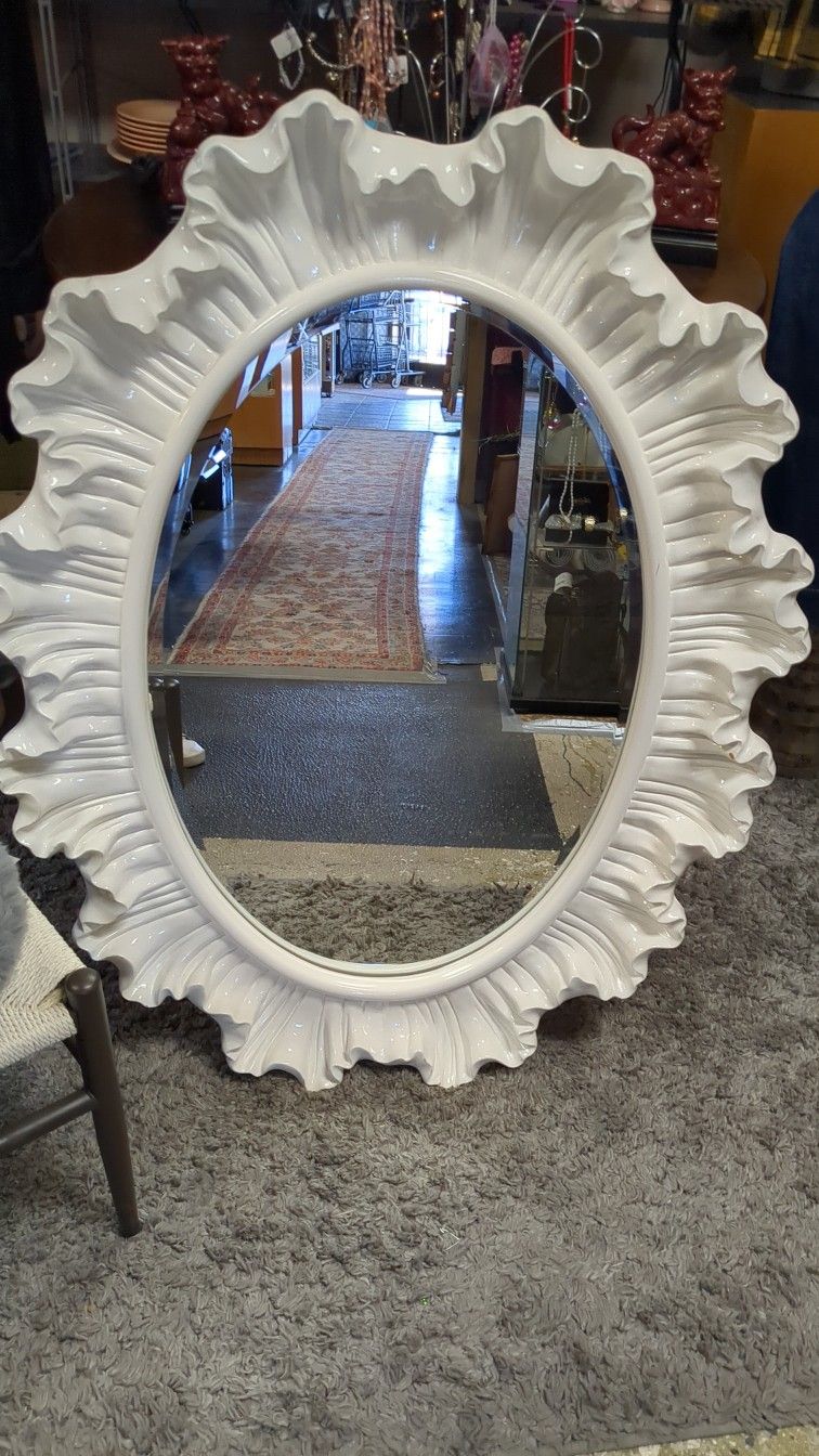 Large, Classy white ruffled mirror, Can be hung horizontally or vertically details in pictures.
Measures 35 in wide 47 in tall
