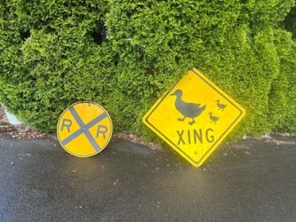 Duck crossing sign and railroad crossing sign both in good condition.   If you want the duck crossing sign it’s $50 and the railroad crossing sign is