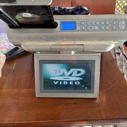 Portable vintage DVD player with  flip screen and over 35 DVDs collectors edition Portable vintage DVD player would flip screen and over 35 DVDs colle