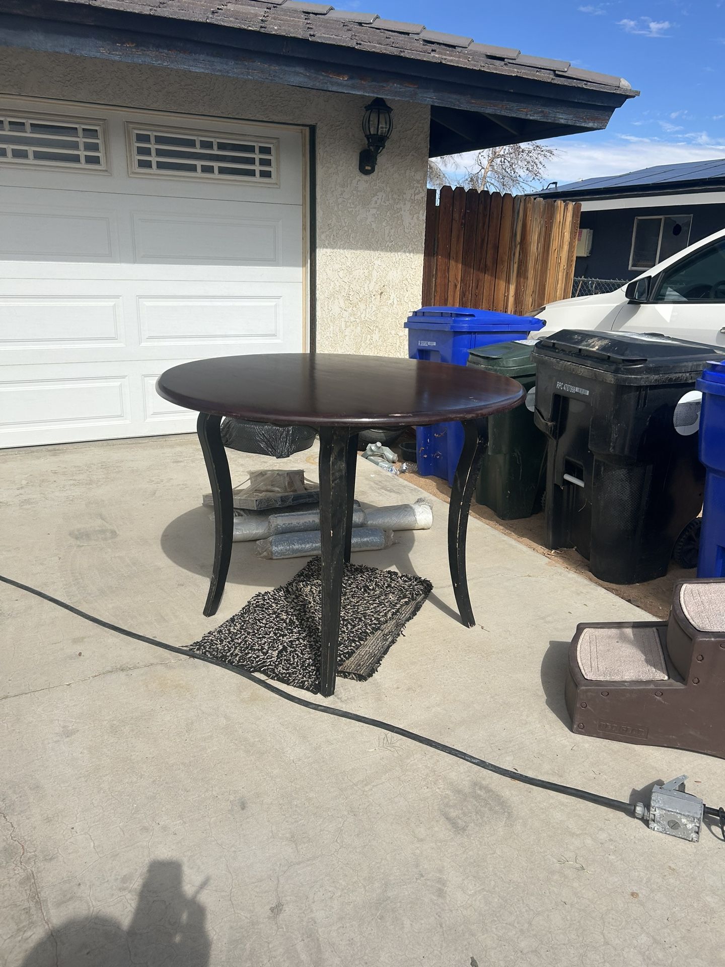 Round Dining Table with Long Curved Legs – Dark Wood Finish