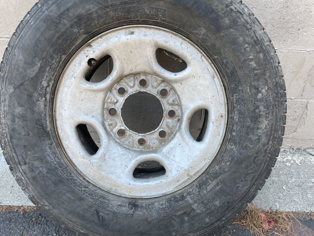 8 lug steel Chevy or GMC 2500 HD rim and old tire. Good spare