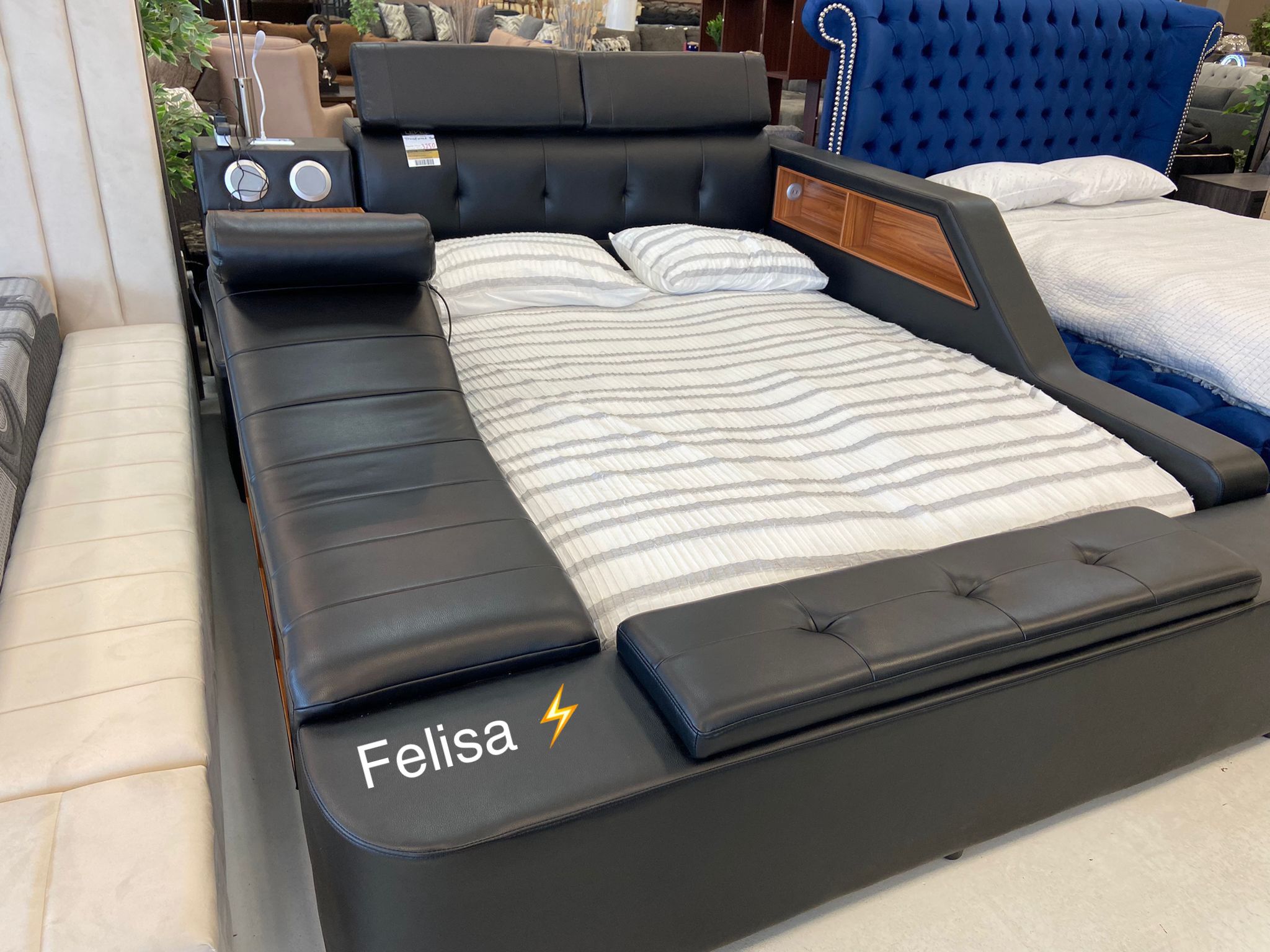 Transformer Bed in black leather, with massage chair, desk, vaul, night lamp, sound unit with usb port, and usb charging ports for cell phones 