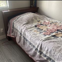 Twin size bed with the nightstand and mattress