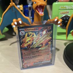 Pokémon card and two Charizard