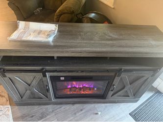 Tv council with fireplace