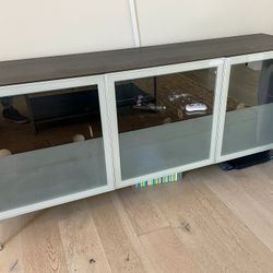 Console with glass doors in fair condition as is pick up only.   75.5x19.5 x 33 