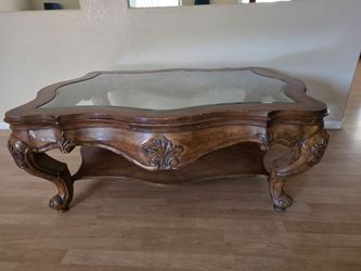 Elegant Carved Wood Coffee Table with Glass Top