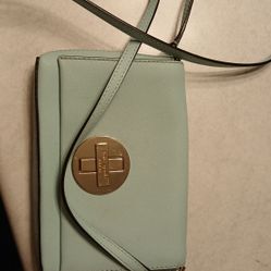  Kate Spade Newbury Lane Sally crossbody bag in blue saffiano leather. 