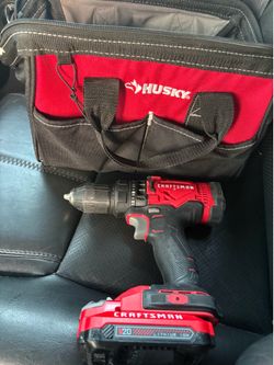 Craftsman 20V drill and husky tool bag.