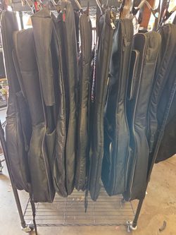 Assorted electric and acoustic guitar gig bags starting at