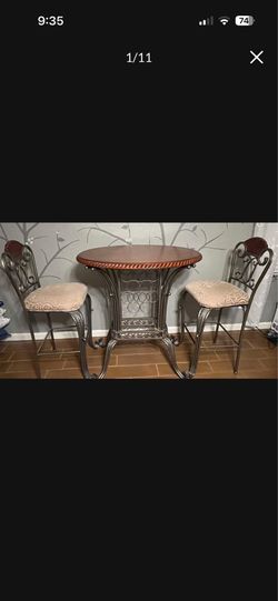 3 piece heavy duty rod iron and wood bar table and bar stools with 10 bottle holders. b250