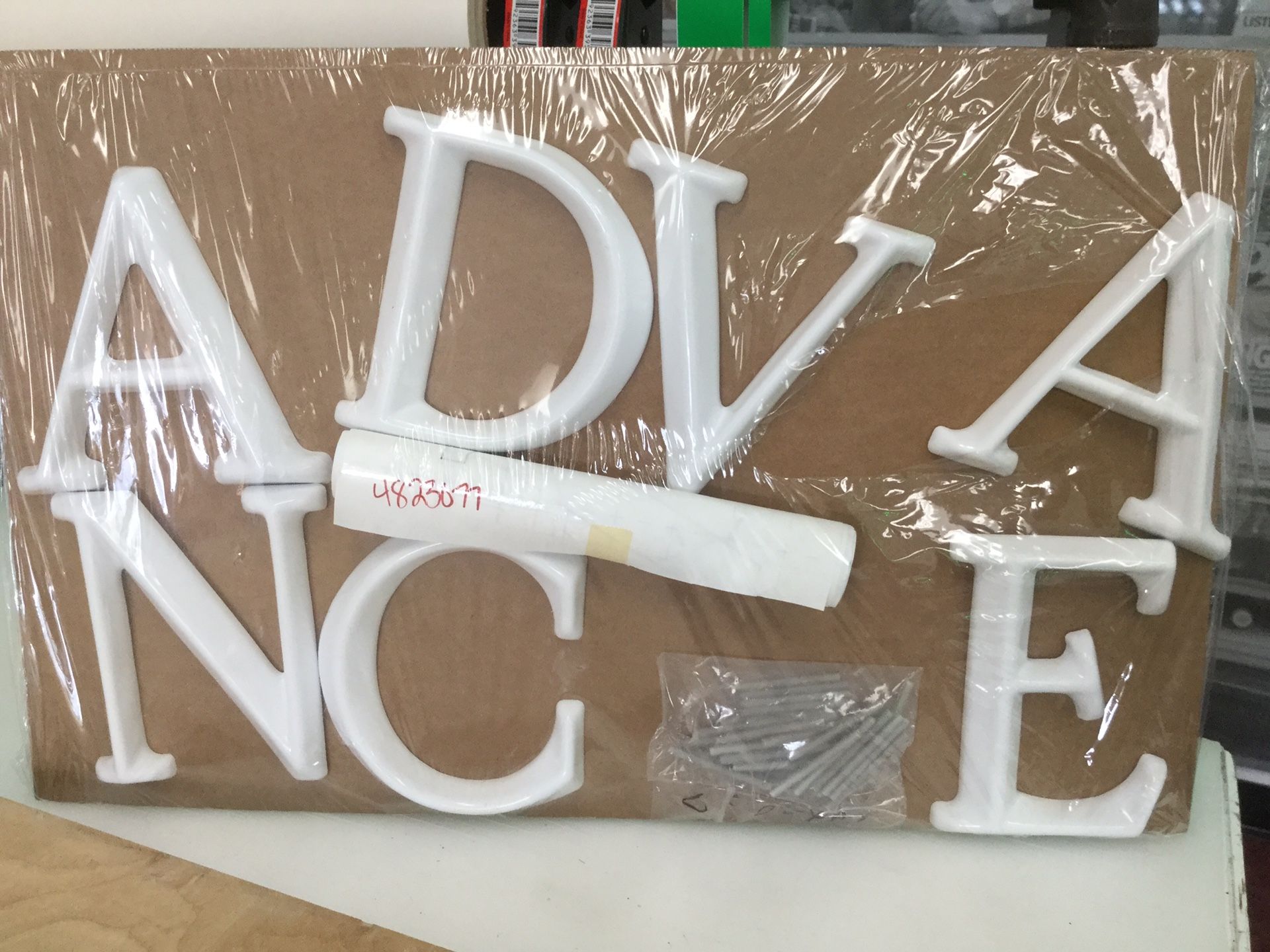 “Advance” lettering