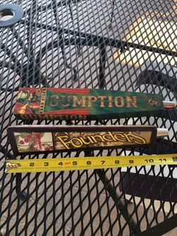 Two unique beer tap handles