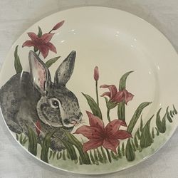Decorative ceramic Easter Spring plate by Maxcera featuring a hand-painted rabbit and lilies. 14”