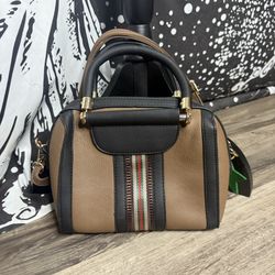 Brown and black shoulder and hand bag
