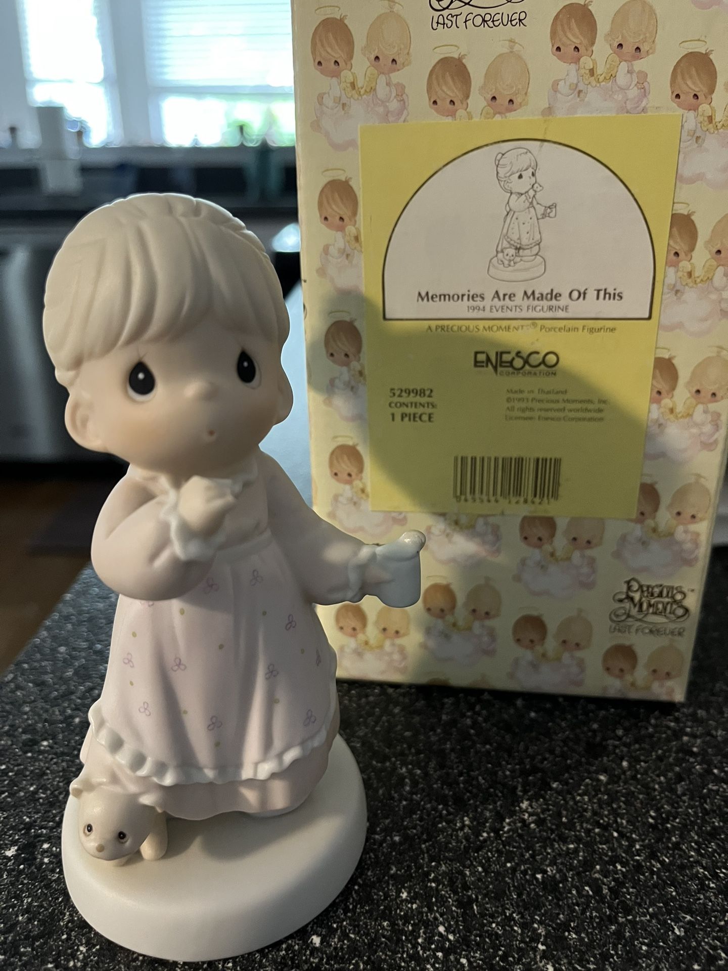 Precious moments, several left displayed In cabinet