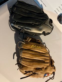 Baseball gloves, two different sizes