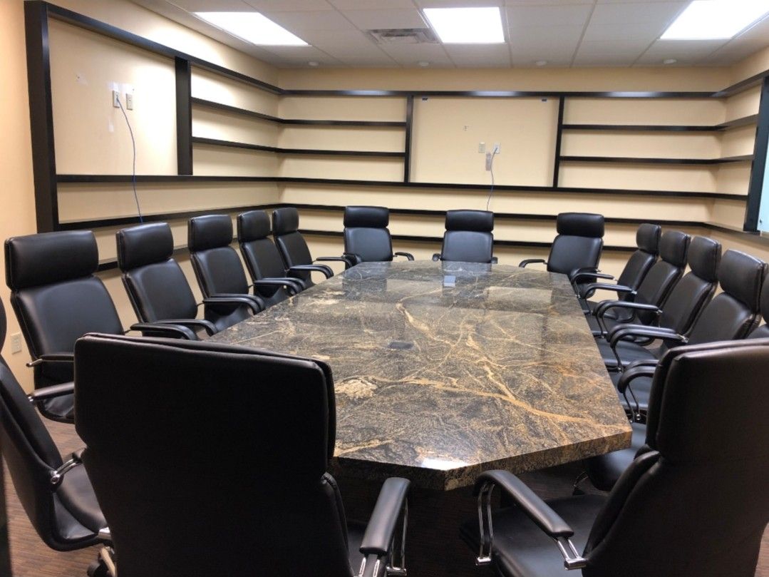 Large solid granite conference room table w/ 16 chairs