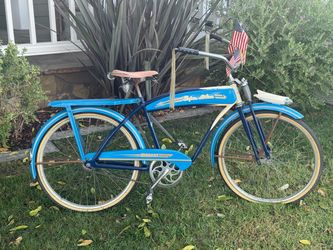 Monark mens  super deluxe-bike with tank and horn rear rack, springer fork excellent condition not sure on year thinking late 50s early 60s  but its s