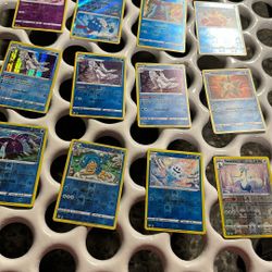 Mixed Pokemon Trading Cards & Tin Box