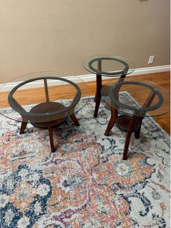 Three piece glass top coffee table set