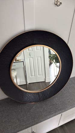 Black and gold round mirror