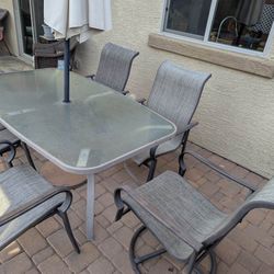 Patio Furniture,  5 Matching Chairs , Tempered Glass Table, Umbrella with Base. 