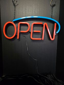 LED "OPEN" sign,features red lettering for word "OPEN" curved blue swoosh 23"×10