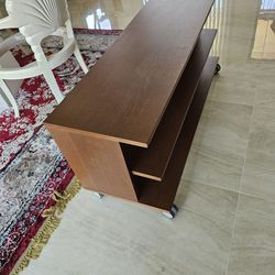 Real Wood tv stand  with  wheels like new L46.5" x D 15" x H 20"