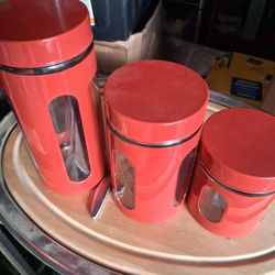 3 piece glass and metal canister set.