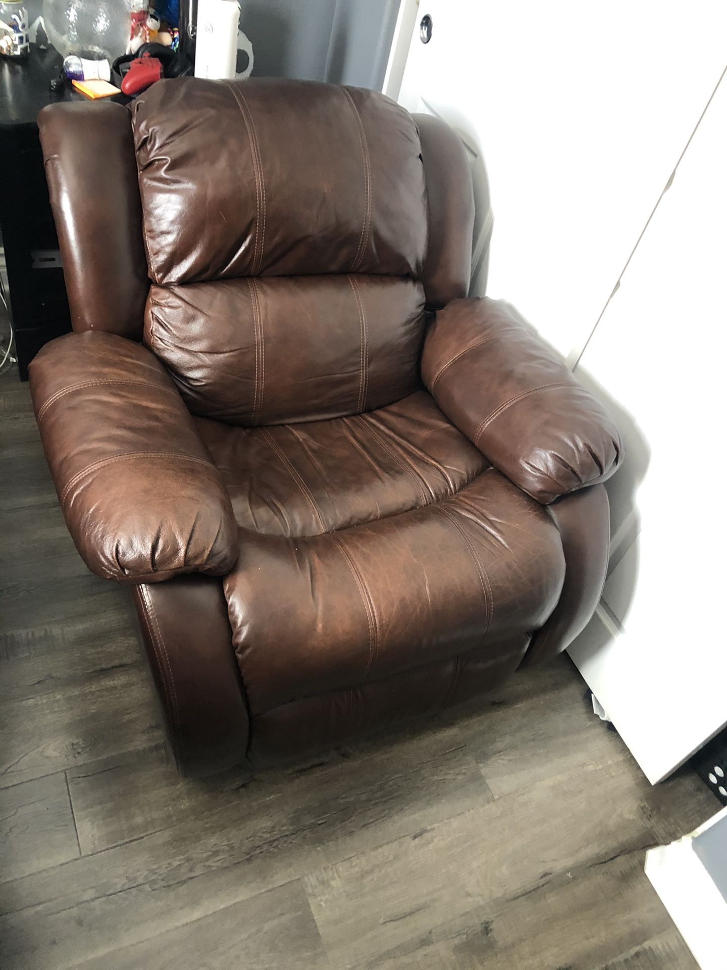 Brown leather recliner in good condition