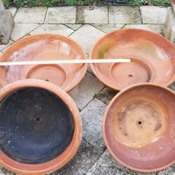 4 large clay pots-good condition with no cracks. 19-30 ,inches with approx. 12 inch bases. One pot has ceramic inlay  plaques in perfect condition!  P
