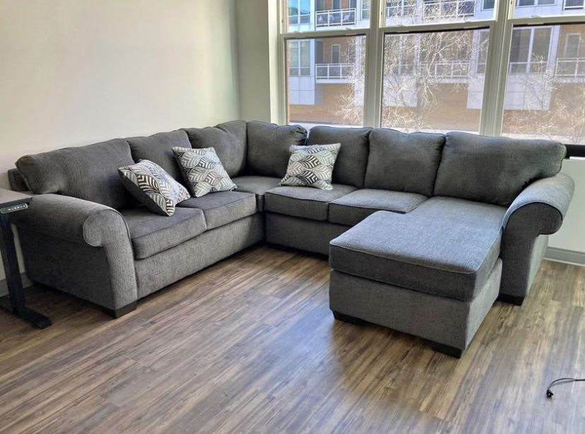 Brand New. Grey Sectional With Reversible Chaise
