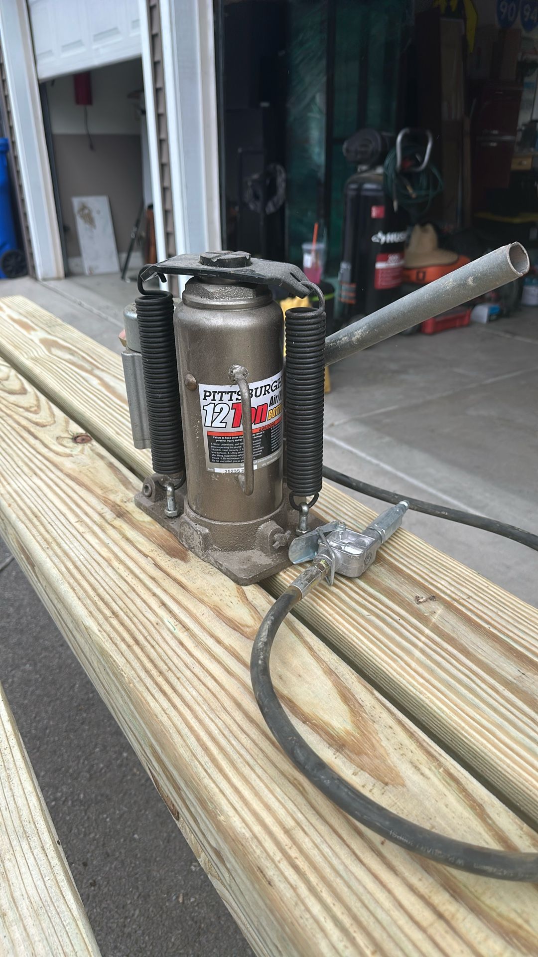 Two. 12 Ton Air Hydraulic Bottle Jack