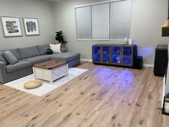 High end Brand new couch with 2 grey pillows