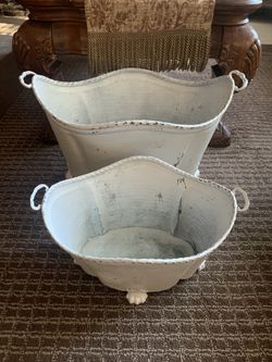 old aluminum containers with cast iron edges