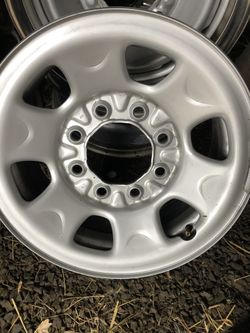 2 sets of 16” GM wheels (8) with 4 Chevy center caps