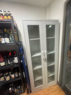 White cabinet with glass doors
