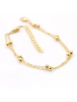 Gold colored anklet