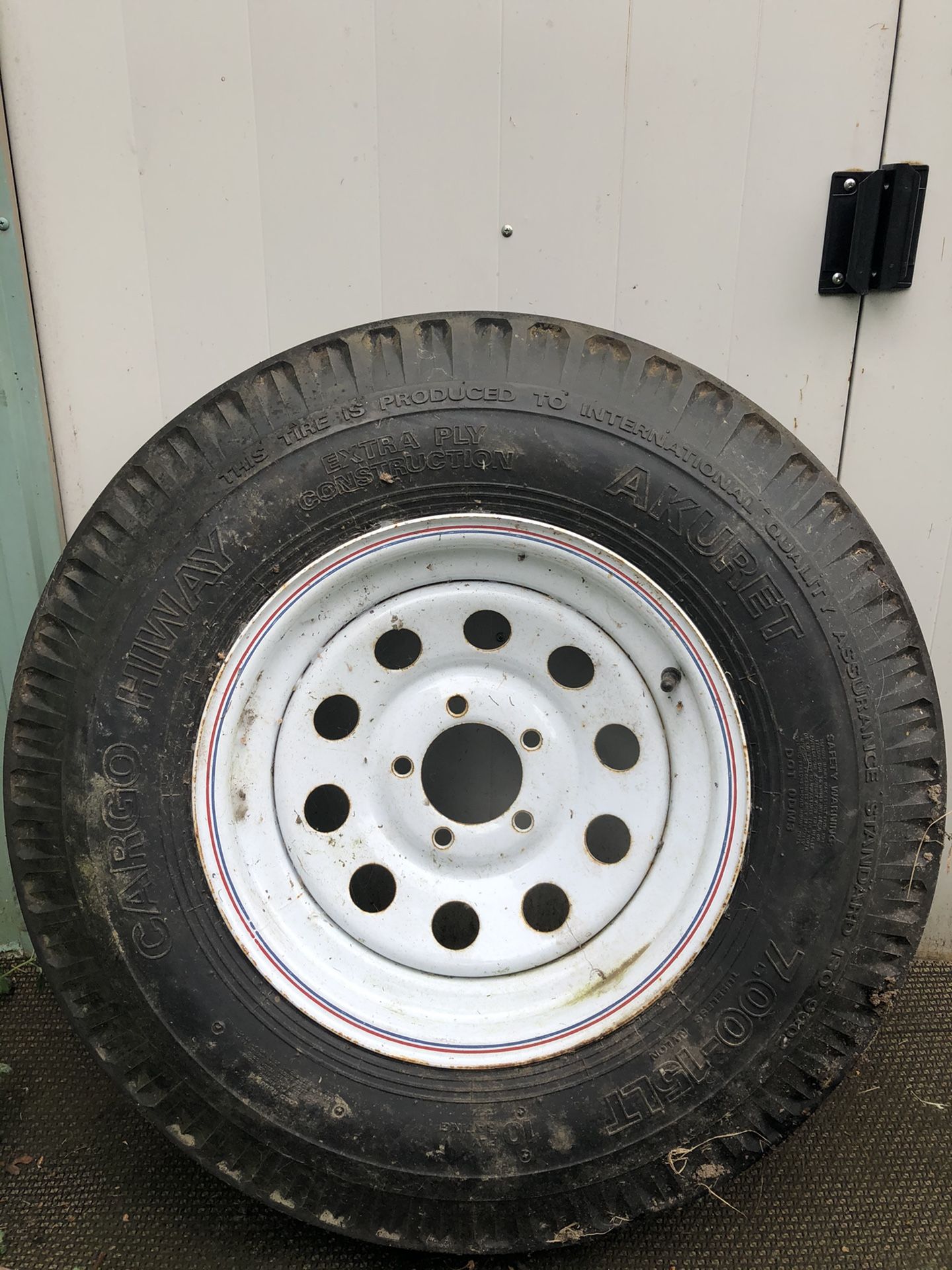 Trailer tire and rim. 7 x 15 LT