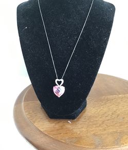 Beautiful Pink Crystal Heart Pendant attached to another smaller silver tone Heart and tiny crystals.