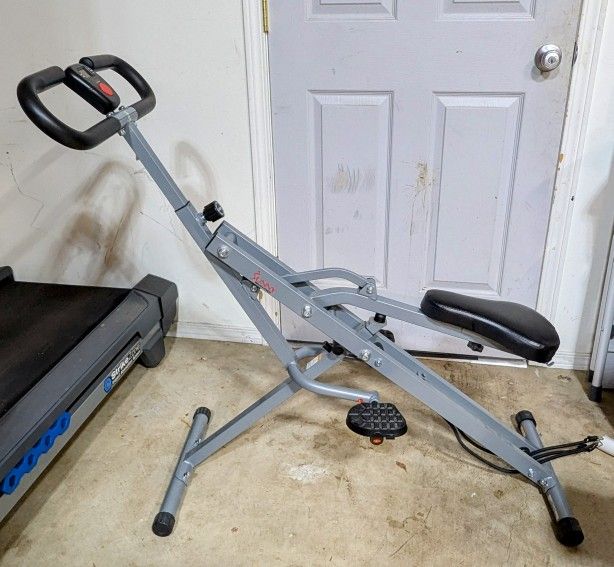 Sunny Health And Fitness Upright Row-N-Ride Squat Assist Trainer Machine for Abs and Glute Workout