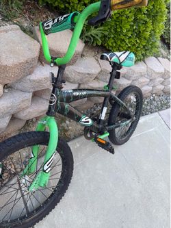 Green surge kids trick bike