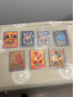 7-card lot of the iconic 1999 Topps Pokemon "The First Movie" Embossed Evolution