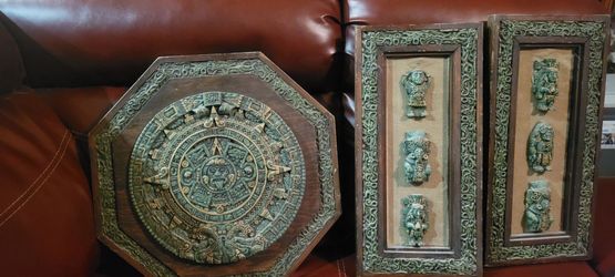 vintage Mexican wall art plaques featuring Mesoamerican motifs.Materials: They are typically constructed from a wooden base featuring relief sculpture
